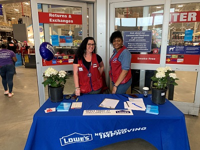 two employees at lowe's booth